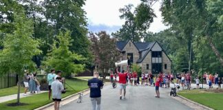 Jaccob Slavin Stanley Cup Day: Olympic Gold Around the Cup Jaccob Slavin Carolina Hurricanes defenseman carries the Stanley Cup down his Raleigh neighborhood street during his day with the Cup August 2026