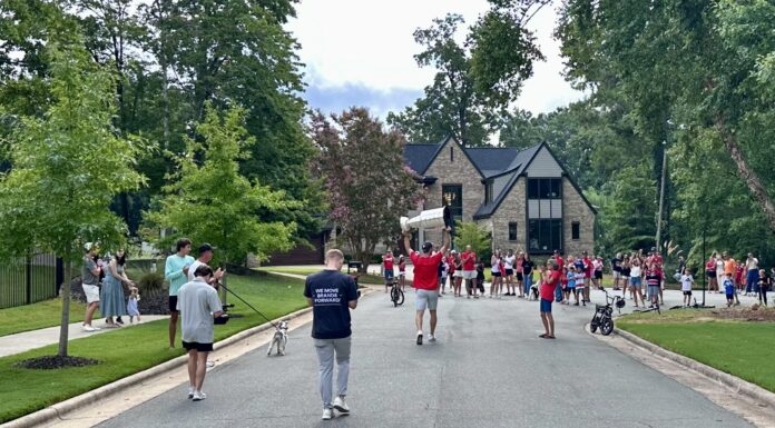 Jaccob Slavin Stanley Cup Day: Olympic Gold Around the Cup Jaccob Slavin Carolina Hurricanes defenseman carries the Stanley Cup down his Raleigh neighborhood street during his day with the Cup August 2026