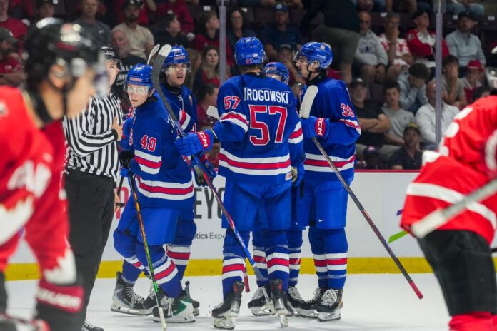 usa-canada-world-junior-summer-showcase-2026 Team USA celebrates a goal against Canada in the 2026 World Junior Summer Showcase finale in Windsor
