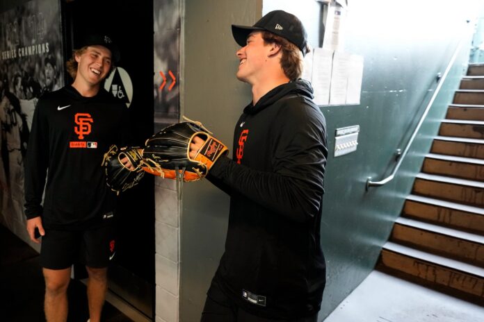 Will Smith and Macklin Celebrini at Oracle Park Sharks forwards Will Smith and Macklin Celebrini in San Francisco Giants gear at Oracle Park