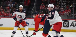Zach Werenski of the Columbus Blue Jackets defends in front of the net at Capital One Arena