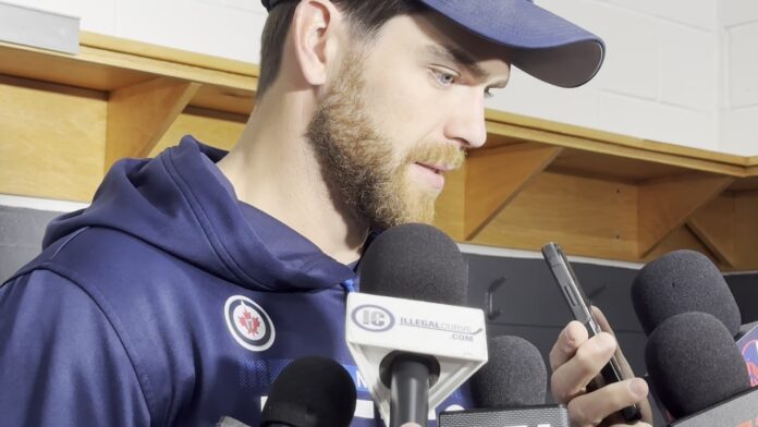 Adam Lowry Hellebuyck Trade Jets 2026 Winnipeg Jets captain Adam Lowry speaks to media about the Connor Hellebuyck trade request ahead of 2026-27 training camp