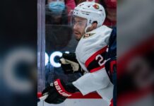 Artem Zub Injury: Senators D Likely Out for Opener Artem Zub of the Ottawa Senators battles along the boards in a white road jersey