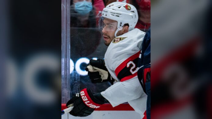 Artem Zub Ottawa Senators defenseman Artem Zub of the Ottawa Senators battles along the boards in a white road jersey