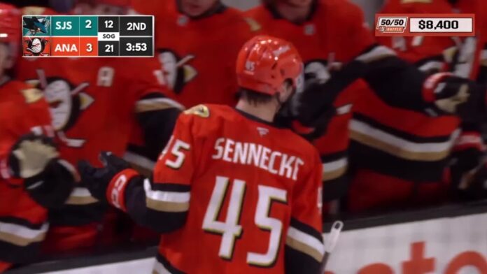 Beckett Sennecke celebrates along the Anaheim Ducks bench after scoring against the San Jose Sharks in the preseason opener