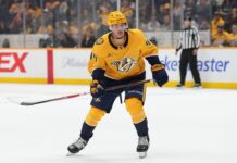 Brady Martin: Predators Assign Top Prospect to AHL Brady Martin skates in Nashville Predators gold jersey during NHL action