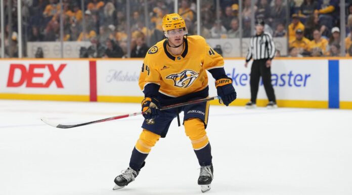 Brady Martin: Predators Assign Top Prospect to AHL Brady Martin skates in Nashville Predators gold jersey during NHL action