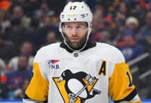 Bryan Rust Injury: Penguins Winger Exits Preseason Finale Bryan Rust in Pittsburgh Penguins white road jersey wearing the A