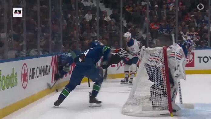 Filip Chytil referee collision Filip Chytil collides with referee Riley Brace along the boards during Canucks-Oilers preseason game