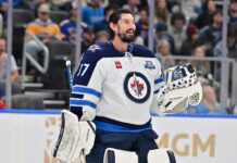 Hellebuyck Trade: Dreger Doubts He Reports to Jets Camp Winnipeg Jets goaltender Connor Hellebuyck during a timeout against the St. Louis Blues