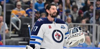 Hellebuyck Trade: Dreger Doubts He Reports to Jets Camp Winnipeg Jets goaltender Connor Hellebuyck during a timeout against the St. Louis Blues