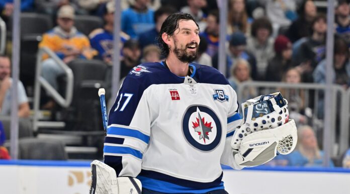Hellebuyck Trade: Dreger Doubts He Reports to Jets Camp Winnipeg Jets goaltender Connor Hellebuyck during a timeout against the St. Louis Blues