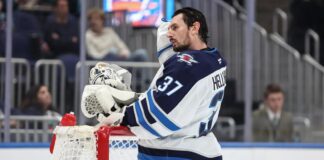 NHL Trade Requests: Daly Says No Fix Until the 2030 CBA Winnipeg Jets goaltender Connor Hellebuyck leans on the net during a timeout against the New York Islanders