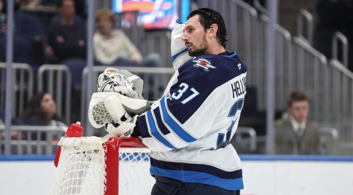 NHL Trade Requests: Daly Says No Fix Until the 2030 CBA Winnipeg Jets goaltender Connor Hellebuyck leans on the net during a timeout against the New York Islanders