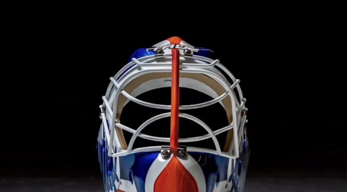 Devon Levi Mask: Oilers Goalie Channels Grant Fuhr Devon Levi 2026-27 Edmonton Oilers goalie mask front view with orange stripe down the cage