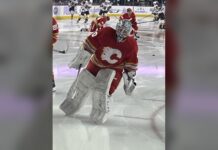 Flames EBUG Signing: Dusty Nickel Gets a Full-Time NHL Job Dusty Nickel in Calgary Flames goalie gear during warmups as the Flames name him their full-time emergency backup goaltender EBUG for 2026-27