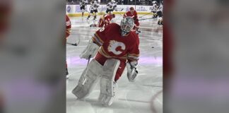 Flames EBUG Signing: Dusty Nickel Gets a Full-Time NHL Job Dusty Nickel in Calgary Flames goalie gear during warmups as the Flames name him their full-time emergency backup goaltender EBUG for 2026-27