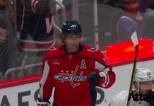 Jordan Kyrou Scores First Capitals Goal in OT Win Dylan Strome celebrates a goal for the Washington Capitals in a red home jersey against the Boston Bruins