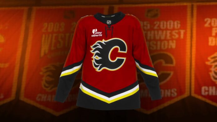 Calgary Flames 2004 throwback Black C jersey Calgary Flames 2004 throwback alternate jersey with black Flaming C crest hanging in front of Saddledome banners