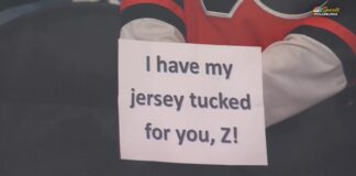 Flyers Tuck Jerseys in Warmup Protest of Zegras Penalty Flyers player holds up sign reading I have my jersey tucked for you Z during warmups referencing Trevor Zegras jersey tuck penalty