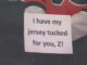 Flyers Tuck Jerseys in Warmup Protest of Zegras Penalty Flyers player holds up sign reading I have my jersey tucked for you Z during warmups referencing Trevor Zegras jersey tuck penalty