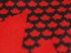Hockey Canada Jersey Reveal Set for Sept. 9 After Teaser Hockey Canada new jersey teaser showing black maple leaves on a red base ahead of the 2027 World Juniors