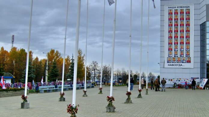 Lokomotiv Yaroslavl memorial banner at Arena 2000 in 2011 Lokomotiv Yaroslavl memorial banner reading Our Team Forever with player portraits on Arena 2000 in Yaroslavl after the 2011 plane crash