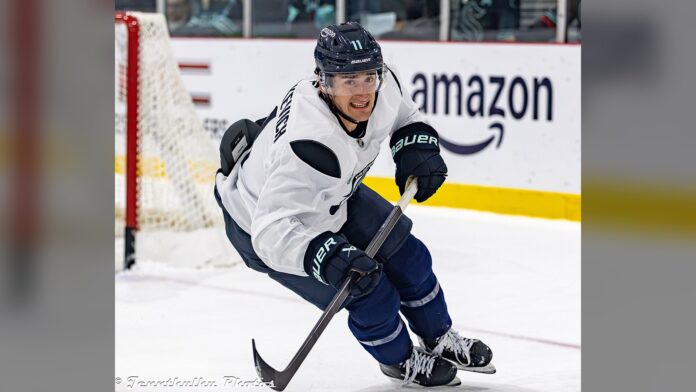 mackie-samoskevich-kraken-practice-2026 Mackie Samoskevich skating in a Seattle Kraken jersey during practice