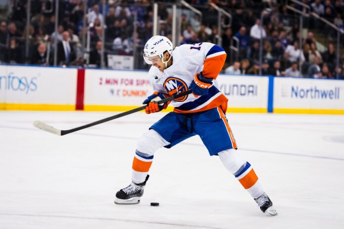 Mathew Barzal Islanders injury 2026 New York Islanders center Mathew Barzal skates with the puck against the New York Rangers at Madison Square Garden