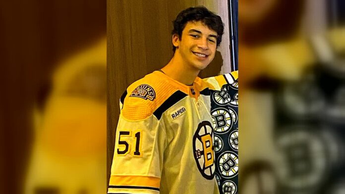 matthew-poitras-bruins-featured Matthew Poitras poses in a Boston Bruins jersey