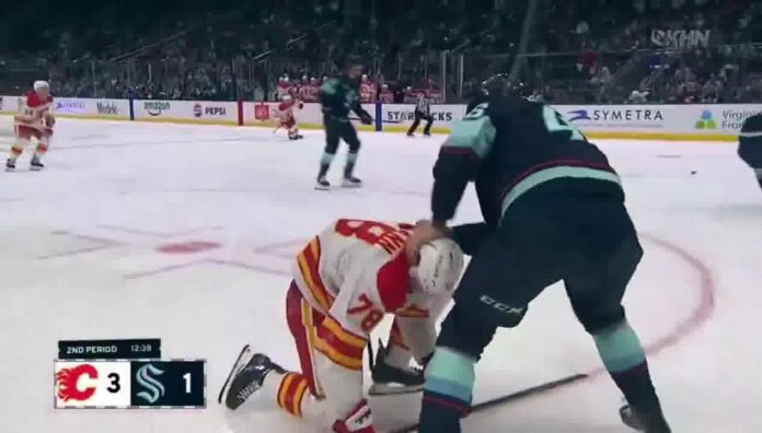 Ville Ottavainen Punches Brennan Othmann Ville Ottavainen grabs Brennan Othmann during Kraken-Flames preseason fight