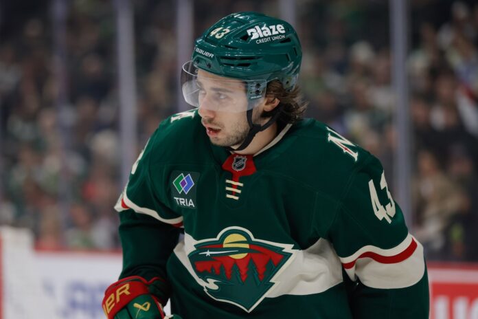 Quinn Hughes Minnesota Wild contract extension deadline Minnesota Wild defenseman Quinn Hughes looks on during a game at Grand Casino Arena in St. Paul