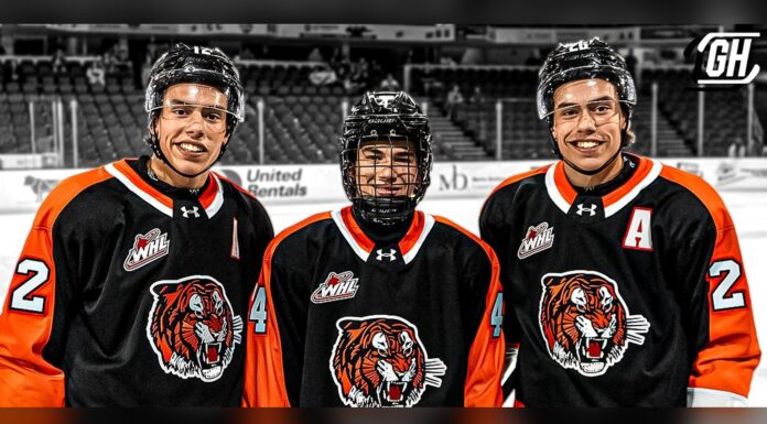 Ruck Brothers Line Up Together, Liam Answers With a Hat Trick Liam Ruck, Landon Ruck and Markus Ruck in Medicine Hat Tigers jerseys before a WHL preseason game