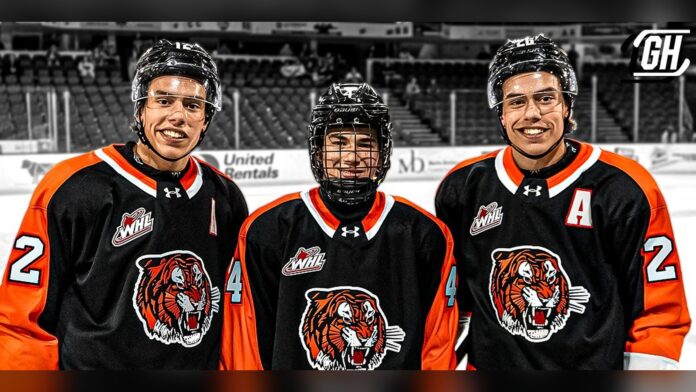 Ruck brothers Medicine Hat Tigers Liam Ruck, Landon Ruck and Markus Ruck in Medicine Hat Tigers jerseys before a WHL preseason game