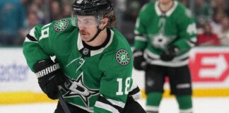 Sam Steel skates with the puck for the Dallas Stars after signing a four-year contract extension
