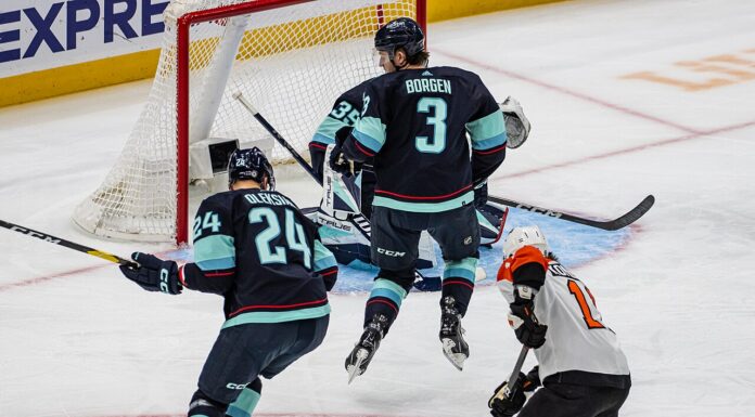 Flyers Winger Trade: Konecny, Tippett Drawing Interest Travis Konecny shoots through traffic in front of the Seattle Kraken net