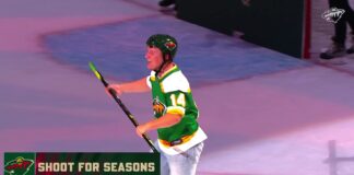 Wild Fan Wins Season Tickets With Center Ice Shot Minnesota Wild fan in a green Joel Eriksson Ek throwback jersey celebrates after scoring from center ice during the Shoot for Seasons contest at Grand Casino Arena