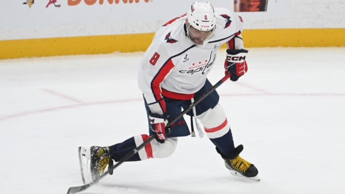 Alex Ovechkin Capitals shot Penguins Washington Capitals captain Alex Ovechkin takes a shot in a white road jersey against the Pittsburgh Penguins