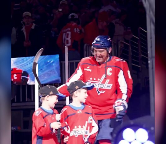Alex Ovechkin with sons Sergei and Ilya after they introduced him at the Capitals 2026-27 home opener at Capital One Arena