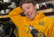Andrei Kuzmenko Returns to Penguins, Switches to No. 62 Andrei Kuzmenko wearing a Penguins number 62 hoodie as he speaks to reporters in the Pittsburgh dressing room after returning to practice