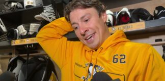 Andrei Kuzmenko Returns to Penguins, Switches to No. 62 Andrei Kuzmenko wearing a Penguins number 62 hoodie as he speaks to reporters in the Pittsburgh dressing room after returning to practice