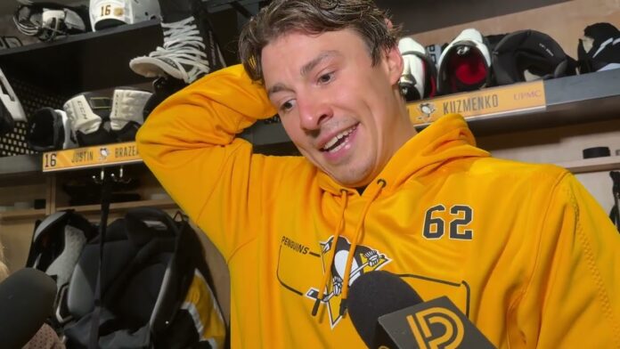 Andrei Kuzmenko Penguins return statement Andrei Kuzmenko wearing a Penguins number 62 hoodie as he speaks to reporters in the Pittsburgh dressing room after returning to practice