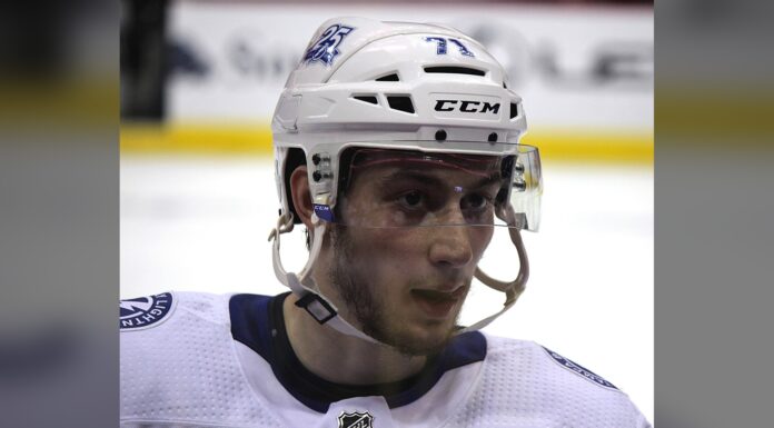 Cirelli Injury: Lightning Center Exits Win Over Vegas Lightning center Anthony Cirelli in white road jersey and helmet during warmups