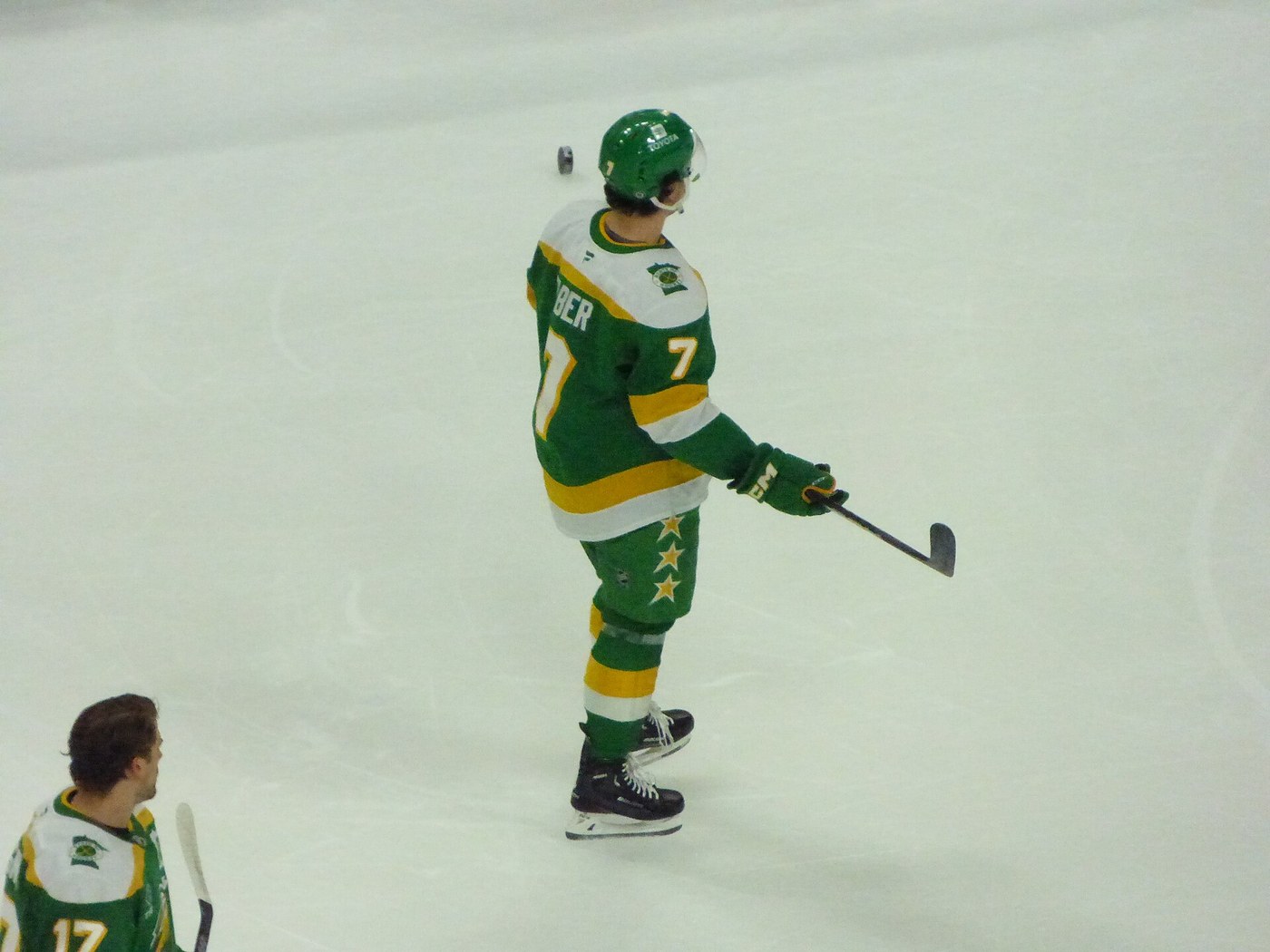 Brock Faber skating in warmups in the Minnesota Wild retro green and gold jersey