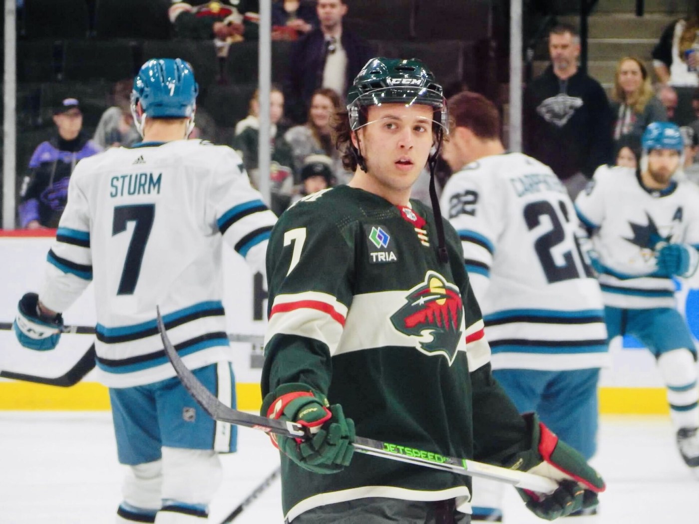 Brock Faber in warmups wearing the Minnesota Wild green home jersey