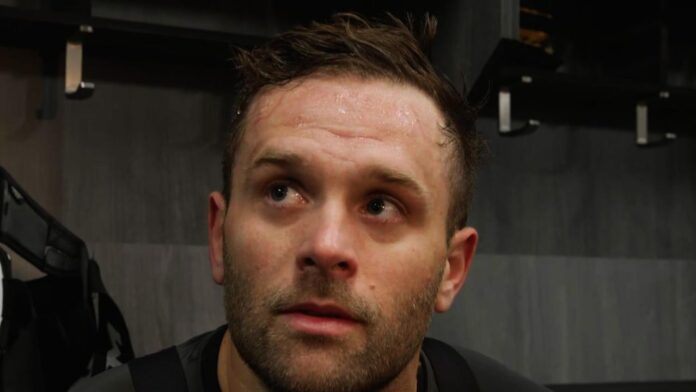 bryan-rust-penguins-injury-utah Penguins winger Bryan Rust speaking to media in the locker room