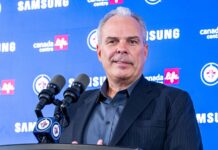 Cheveldayoff Hellebuyck Trade: Wishes It Happened Sooner Winnipeg Jets GM Kevin Cheveldayoff at podium discussing Connor Hellebuyck trade to Devils