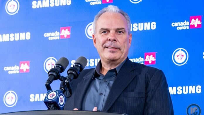Kevin Cheveldayoff Hellebuyck trade Jets press conference Winnipeg Jets GM Kevin Cheveldayoff at podium discussing Connor Hellebuyck trade to Devils
