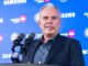 Cheveldayoff Hellebuyck Trade: Wishes It Happened Sooner Winnipeg Jets GM Kevin Cheveldayoff at podium discussing Connor Hellebuyck trade to Devils
