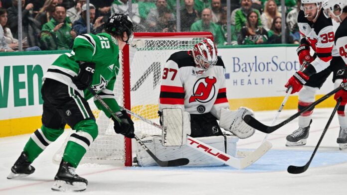 Connor Hellebuyck Devils debut win Stars Connor Hellebuyck makes a save for the New Jersey Devils against the Dallas Stars in his Devils debut